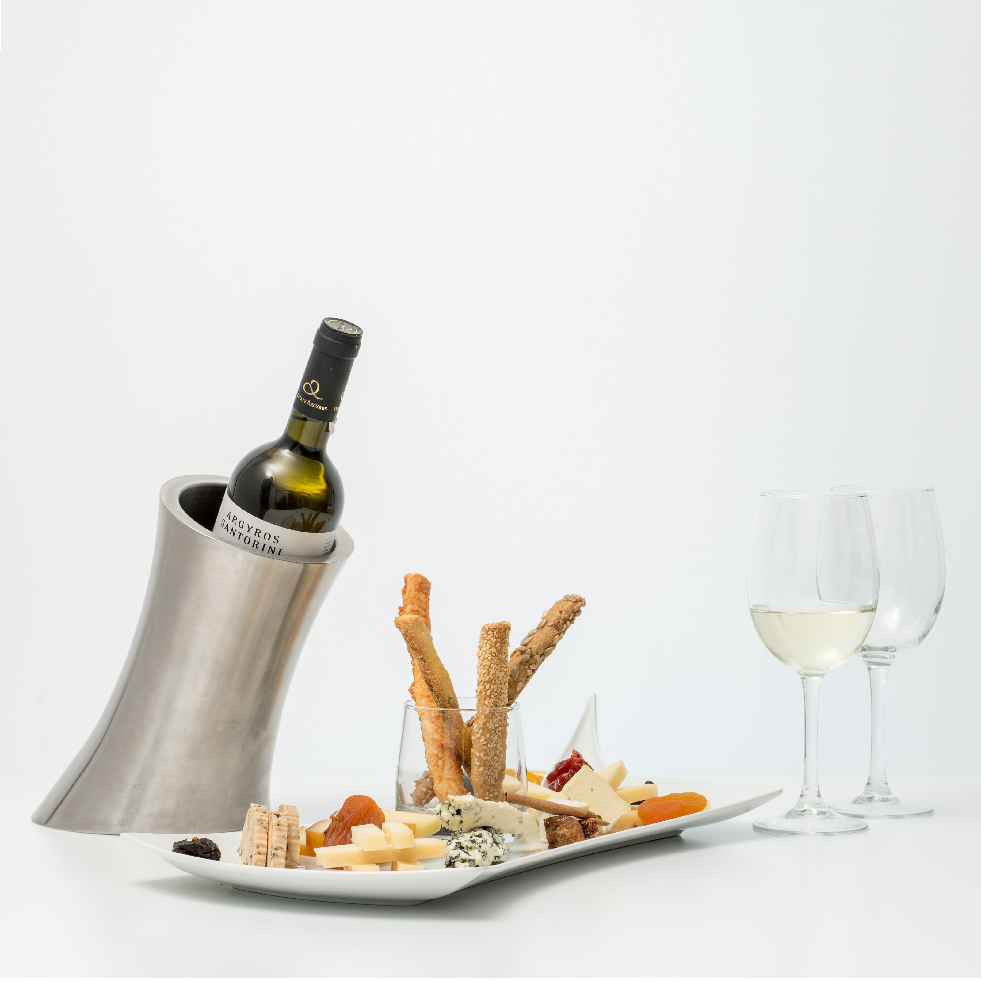 Bottle Of White Wine With Cheese Platter And Dried Fruits